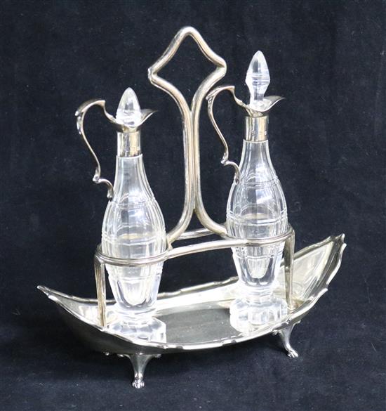 A 1920s silver boat shaped oil and vinegar cruet stand,